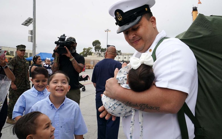 Oh baby! USS Vinson sailors return to hug new children after 9-month deployment